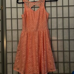 Peach coral lace overlay skater style dress M. Cut out on chest. Zippered back.